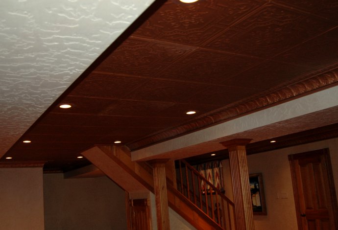 Copper-painted metal ceiling.